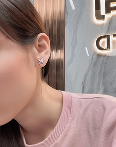 Close-up of S925 sterling silver four-petal flower stud earrings with marquise-cut zircons