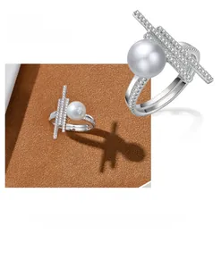 Detailed macro of 925 sterling silver ring with pearl and geometric pavé diamonds