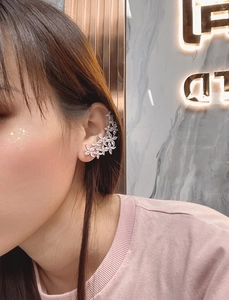 Close-up of S925 sterling silver snowflake ear climber with sparkling zircon stones