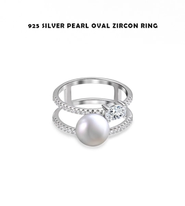 Detail view of double-layer 925 silver ring featuring a large white pearl and oval zircon