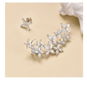 Detailed view of silver snowflake earring set with marquise-cut white cubic zirconia