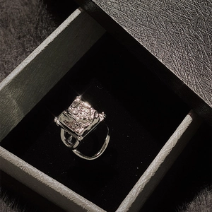 Detailed view of the irregular lava texture on an S925 sterling silver minimalist ring