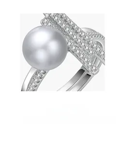 Macro shot of large grey pearl ring featuring multi-row pave diamond settings on silver band