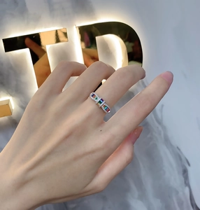 Close-up of rainbow cubic zirconia ring on model hand with 925 silver setting