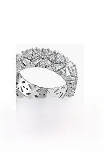 Macro shot of silver-tone full eternity ring with mixed baguette and round cubic zirconia