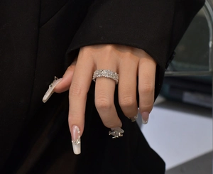 Macro shot of 925 sterling silver wide band ring with shimmering micro pave diamonds
