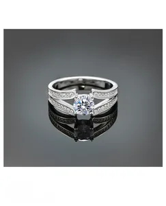 Macro detail of V-shaped S925 silver ring with sparkling round zircon and split shank