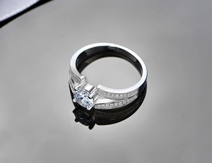 Macro view of S925 sterling silver V-side ring with brilliant round zircon in four-prong setting
