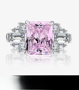 Macro detail of radiant cut pink gemstone set in silver-plated luxury ring band