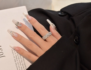 Close-up of 925 sterling silver eternity ring with marquise and round cut zircons on finger