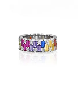 Close-up of multicolor zircon stones set in silver ring band with white diamond accents