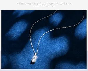 Detailed close-up of 925 sterling silver oval pendant with micro-pave setting detail