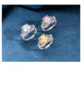 Close-up of S925 silver rings with ice-cut pink, yellow, and white square gemstones