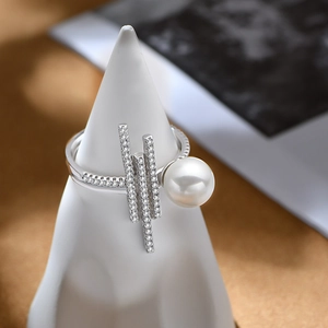 925 silver pearl ring with geometric zircon bars on a white display stand
