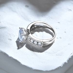 S925 sterling silver ring with cushion-cut carbon diamond on white textured stone