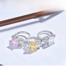 Detailed view of S925 silver rings with emerald cut pink, yellow and white carbon diamonds