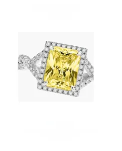 Close-up of S925 silver ring featuring a large rectangular yellow stone and micro-pave diamonds