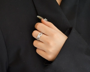 Macro detail of S925 sterling silver V-shape ring with brilliant round zircon and side stones