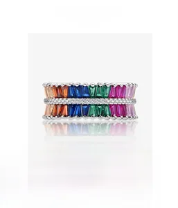 Macro detail of rainbow baguette-cut zircon ring with micro-pave setting on silver base
