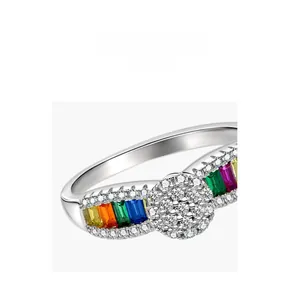 Close-up of rainbow gemstone ring showing detailed pave-set diamonds and step-cut crystals
