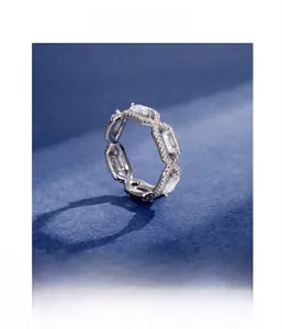 Macro shot of silver ring featuring geometric frames and micro-pave set zircon stones