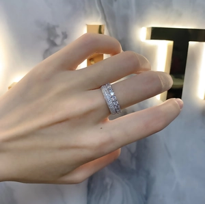 Detailed view of 925 sterling silver double-row micro-pave ring worn on a finger