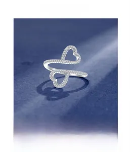 Detailed macro view of the double heart sterling silver ring with micro-pave setting