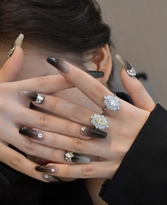 Detail of s925 silver marquise rings with yellow gemstone and gradient rhinestone nails