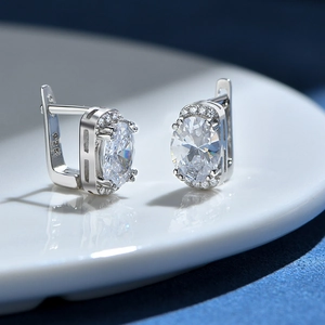 S925 sterling silver hoop earrings with oval cut cubic zirconia and halo setting