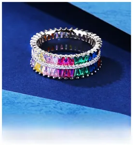 Close-up of rainbow eternity ring with colorful gems and platinum-plated finish