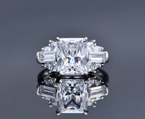 Close-up of S925 silver ring with rectangular ice cut diamond and symmetrical reflection