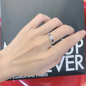 Elegant silver rainbow gemstone ring featuring colorful baguette stones and pave crystals
