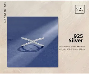 Close-up of S925 sterling silver ring with cross design and pave stones detail