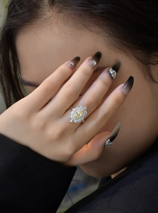 Macro detail of a vintage S925 silver ring featuring a marquise-cut yellow gemstone