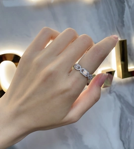 Macro detail of S925 sterling silver infinity ring with rectangular cubic zirconia