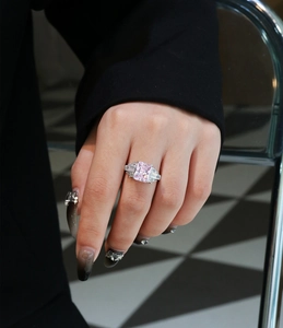 Luxurious pink emerald cut gemstone ring in 925 sterling silver worn on index finger