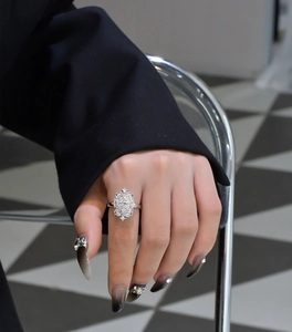 Macro detail of S925 sterling silver ring with yellow marquise cut diamond on hand