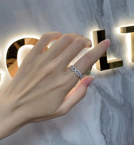 Detailed view of an S925 sterling silver interlaced ring with shimmering pavé set zircons