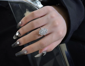 Detailed view of S925 silver ring featuring marquise-cut yellow stone and halo setting