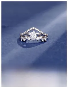 Macro shot of crown-shaped S925 silver ring featuring pear-cut carbon diamond detailing
