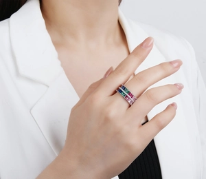 Detailed view of a triple-layer rainbow zircon ring with rectangular multi-color gemstones