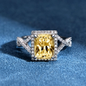S925 sterling silver ring with rectangular yellow gem and diamond halo on braided band