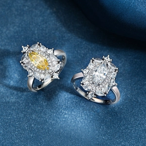 Luxurious S925 silver rings featuring yellow and white marquise-cut zircons on blue silk