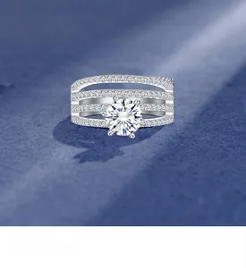 Detail of a six-prong sparkling round diamond on a four-layer silver pavé band ring