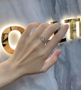 Close-up of a double-layered S925 silver ring featuring a pear-cut teardrop cubic zirconia