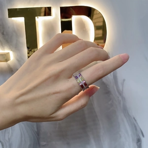 Sterling silver multi-row ring featuring colorful rectangular zircon stones on marble background