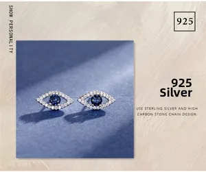 Detailed close-up of S925 sterling silver evil eye stud earrings with blue carbon stone
