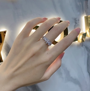Close-up of 925 sterling silver ring with seven marquise-cut zircons on a hand