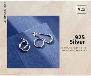 Macro view of 925 sterling silver hoop earrings with detachable carbon diamond charms