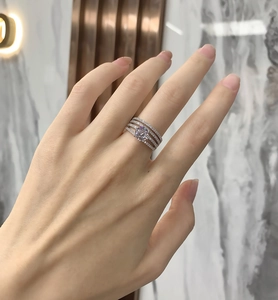 Macro shot of S925 sterling silver multi-layer ring with sparkling pave diamonds